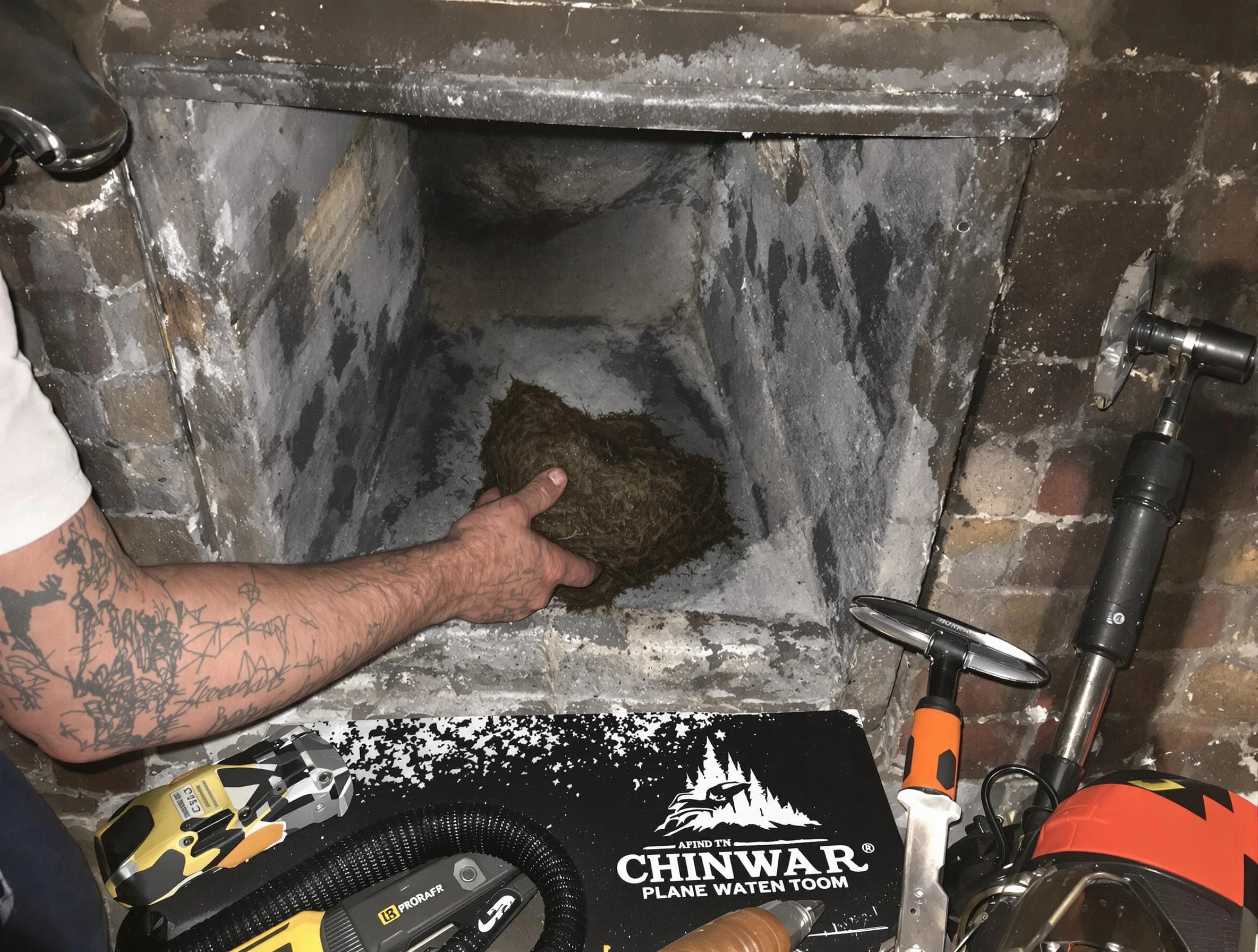 Danvers Chimney Sweep safely removing debris and screening chimney in Danvers, MA